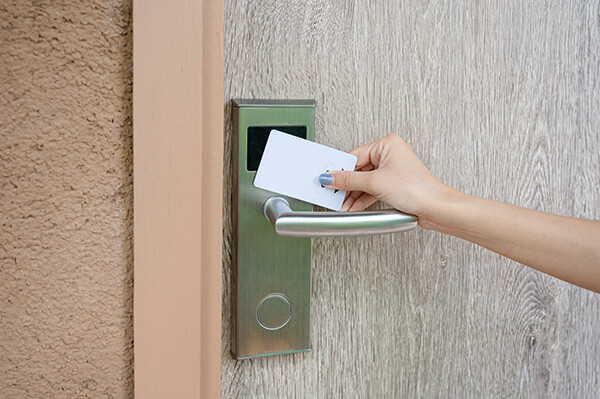 hand-holding-key-card-scanning-unlock-wooden-door-resort 4 vision system